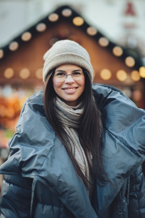 Portrait of beautiful girl with long hair wearing warm winter clの写真素材