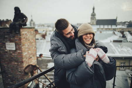 Couple has fun and laughs. kiss. Young hipster couple hugging eaの写真素材