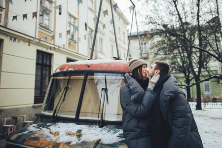 people, season, love and leisure concept - happy couple huggingの写真素材
