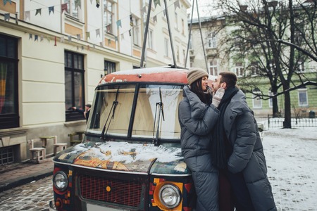 Couple has fun and laughs. kiss. Young hipster couple hugging eaの写真素材