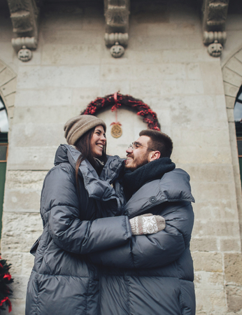 Couple has fun and laughs. kiss. Young hipster couple hugging eaの写真素材
