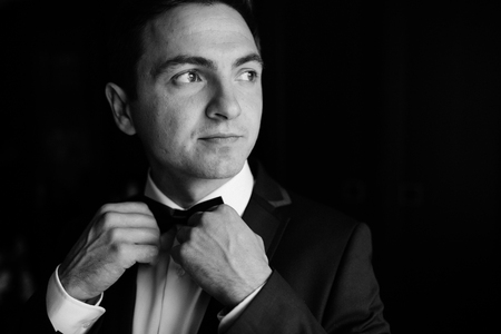 groom getting ready in the morning before wedding ceremony, puttの写真素材