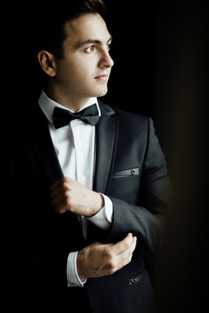 groom getting ready in the morning before wedding ceremony,の写真素材