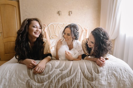 Beautiful girls in the hotel room before weddingの写真素材