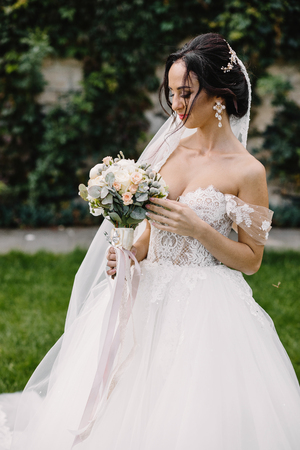 Beautiful bride outdoors in a forest.の写真素材