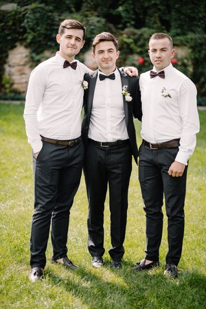 Happy groom and groomsmenの写真素材