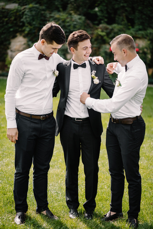 Happy groom and groomsmenの写真素材
