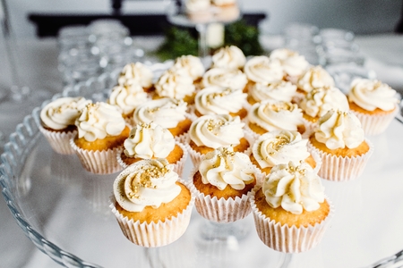 Wedding reception dessert table with delicious decorated white cの写真素材