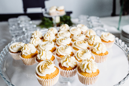Wedding reception dessert table with delicious decorated white cの写真素材
