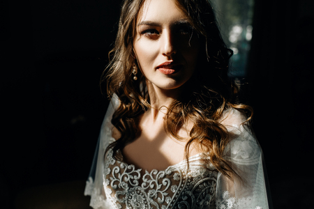 Stuning lady with dark blonde hair and deep blue eyes shines inの写真素材