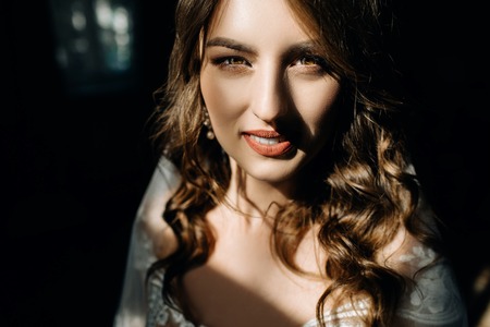 Stuning lady with dark blonde hair and deep blue eyes shines inの写真素材