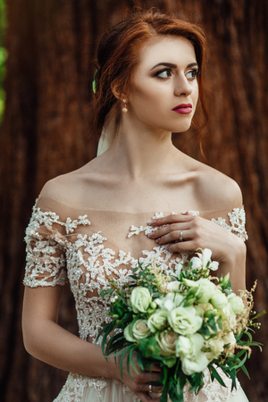nice white wedding bouquet in brides handの写真素材