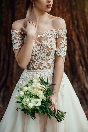 nice white wedding bouquet in bride's handの写真素材