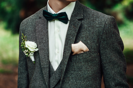 groom at wedding tuxedo smiling and waiting for bride. Rich grooの写真素材