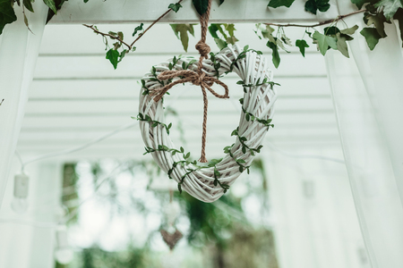 Wedding decoration with flowers and cage for ceremony outsideの写真素材