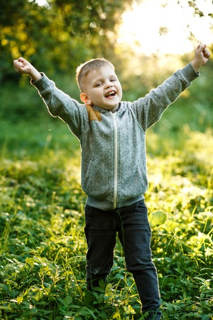 Little young caucasian boy in nature, childhoodの写真素材