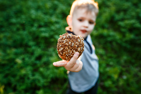 Outdoor portrait of adorable toddler boy in autumn park, havingの写真素材