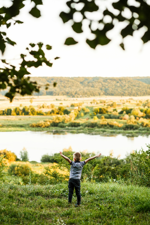 Little young caucasian boy in nature, childhoodの写真素材