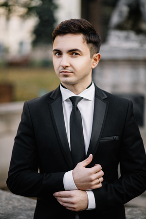 fashion portrait of a man in black suitの写真素材