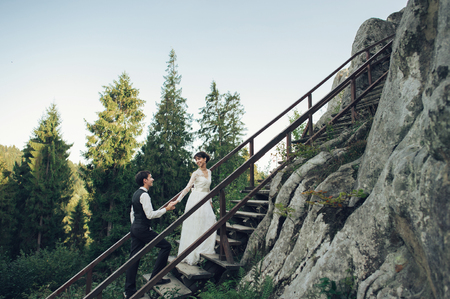 Passionate couple at a beautiful rocky background.の写真素材