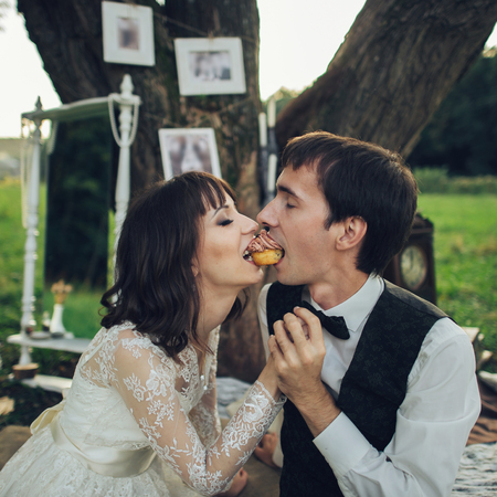 distant view of young caucasian engaged couple on romantic picnicの写真素材
