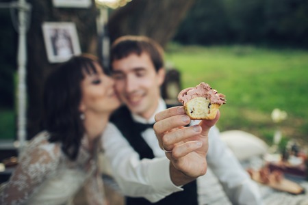 distant view of young caucasian engaged couple on romantic picnicの写真素材