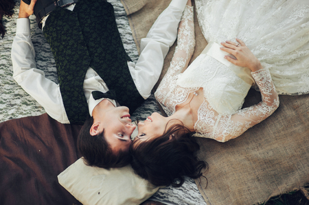 Attractive Couple Enjoying Romantic Sunset Picnic in the Countryの写真素材