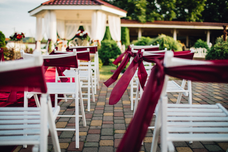 A lot of wedding chairs and luxurious tent near the pgreen lawnの写真素材