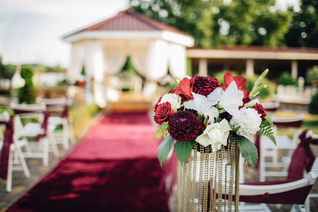 A lot of wedding chairs and luxurious tent near the pgreen lawnの写真素材