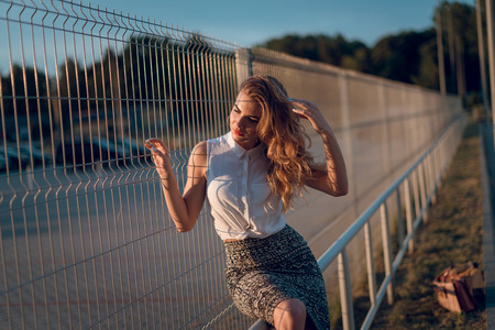 Beautiful fashion woman with  blond hair  and make up posing onの写真素材