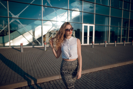 Beautiful fashion woman with  blond hair  and make up posing onの写真素材
