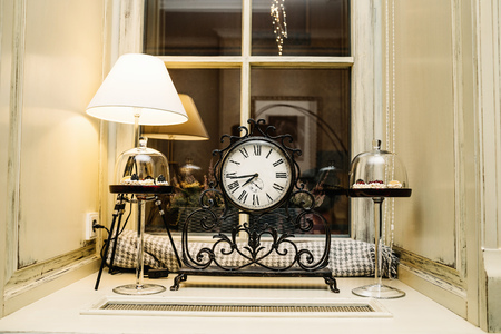 antique clock on table in room ÃÂlose upの写真素材