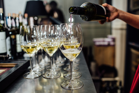 waiter brings glasses of champagneの写真素材