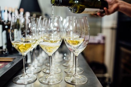 waiter brings glasses of champagneの写真素材