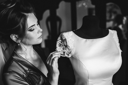 Closeup shot of an elegant, brunette bride in vintage white dresの写真素材