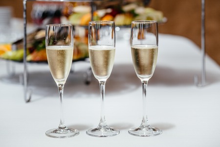 full glasses of champagneの写真素材