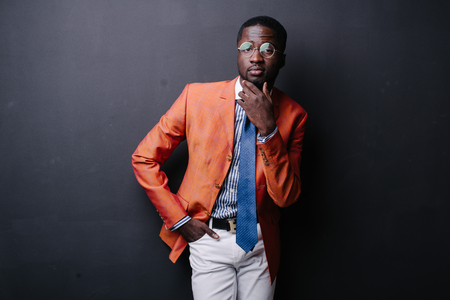 Studio fashion portrait of a handsome young African American businessmanの写真素材