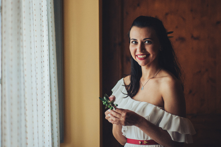 Stunning young bride holding bouquet, portraitの写真素材