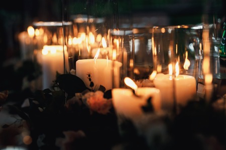 many candles in glass vases on the floor on hipster style weddinの写真素材