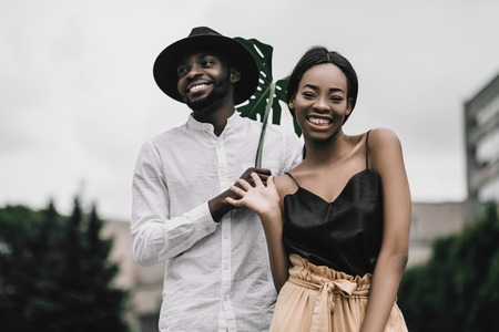 Lovely african newlyweds softly holding each other and smilling.の写真素材
