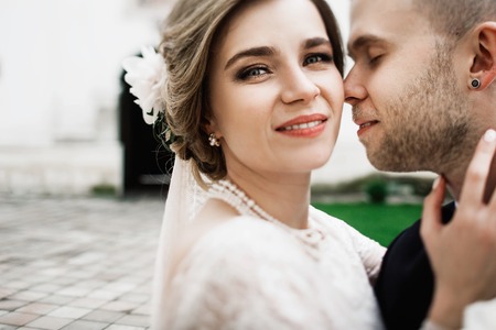 Young wedding couple enjoying romantic moments outsideの写真素材