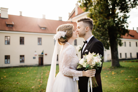 Young wedding couple enjoying romantic moments outsideの写真素材