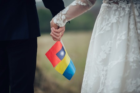 Sensual married couple holding each others hand