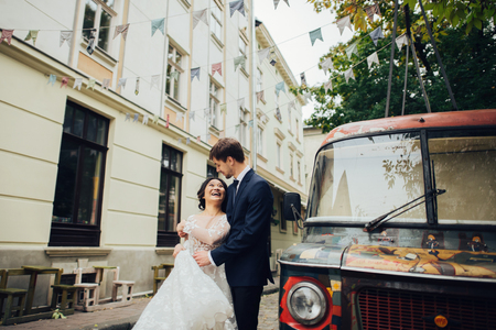 Groom with bride posing in wedding dayの写真素材