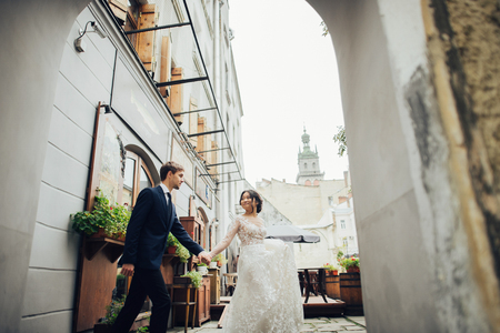 Groom with bride posing in wedding dayの写真素材