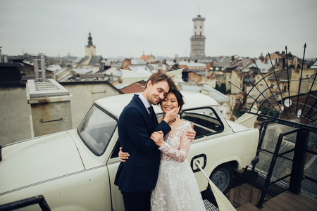 Groom with bride posing outdoor in wedding dayの写真素材