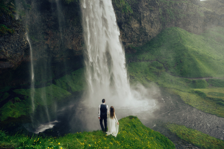 Amazing romantic view of happy couple near beautiful grand waterの写真素材