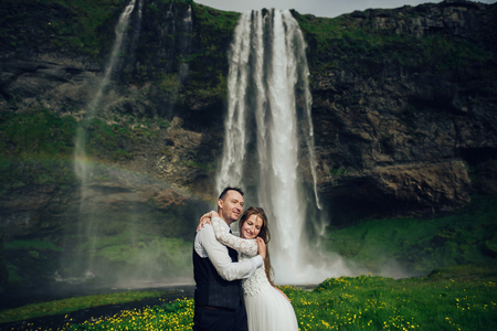 Amazing romantic view of happy couple near beautiful grand waterの写真素材
