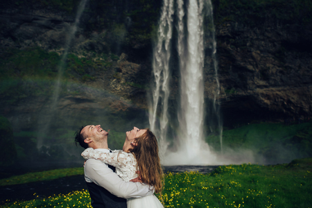 Amazing romantic view of happy couple near beautiful grand waterの写真素材