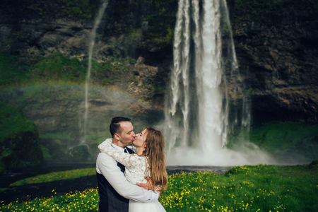 Amazing romantic view of happy couple near beautiful grand waterの写真素材